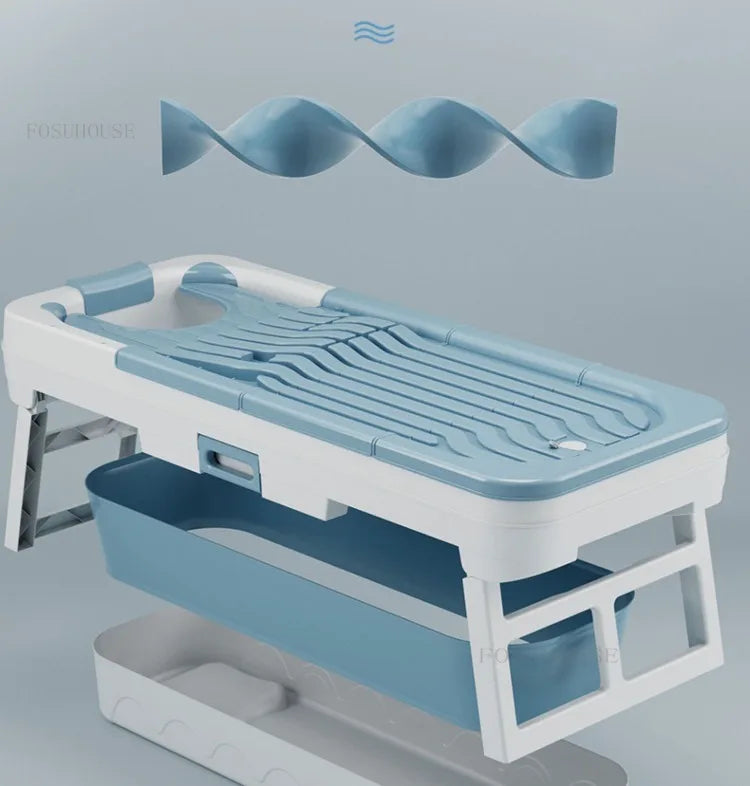Portable folding bathtub for adults in blue and white plastic with stand and lower shelf, MobilityBuy.com.